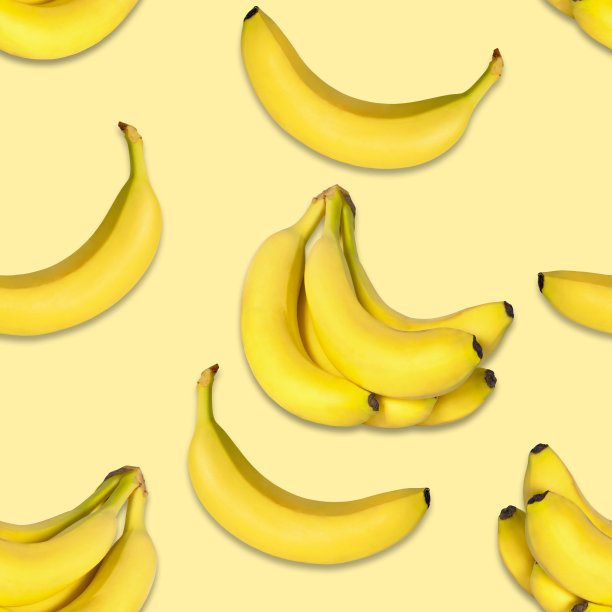 黄色背景上的无缝香蕉图案。自然的香蕉图片下载