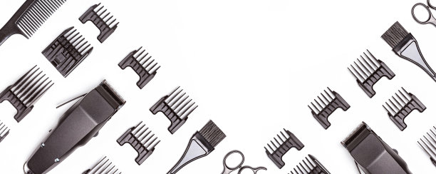 专业的理发器与一套不同大小的喷嘴隔离在白色背景，旗帜图片下载