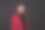 一个女商人的肖像在一个黑色背景的红色西装。图片下载
