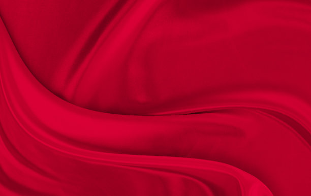 黑色红色缎面深色面料质地豪华闪亮，是抽象的丝绸布料背景与图案柔软的波浪模糊美丽。图片下载