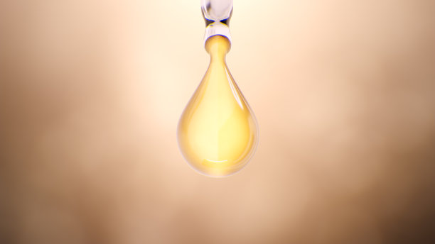 金色奢华胶原蛋白霜滴从滴管。图片下载