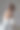 后视图时尚的德国新娘年轻漂亮的女士穿白色婚纱。时尚可爱的封面黑发女人在空灰色的房间摆姿势。时尚潮流风格美概念。复制广告文字空间图片下载