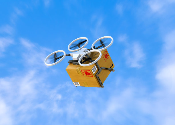 无人机交付的概念。无人机在蓝天的背景下飞行图片下载