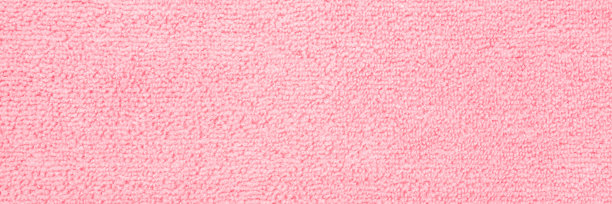 浅粉色干软超细纤维抹布背景。特写镜头。柔和的颜色。宽横幅。文本的空白位置。自顶向下视图。图片下载
