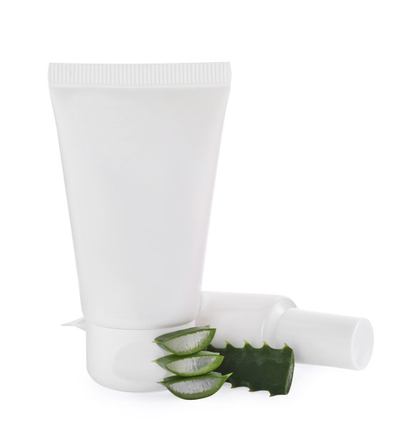 白色背景上涂一管护手霜和芦荟图片下载