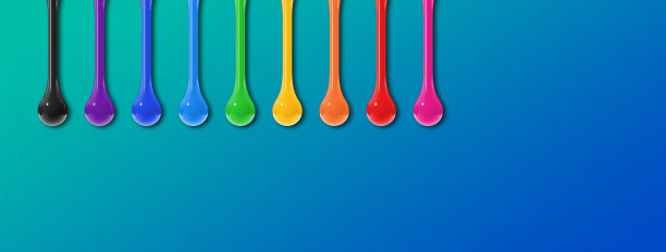 蓝色背景上的彩色墨水滴。水平的旗帜图片下载