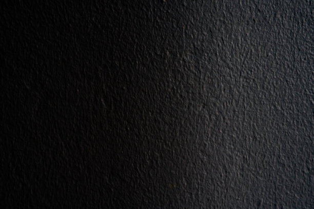 深黑色的墙壁背景。图片下载