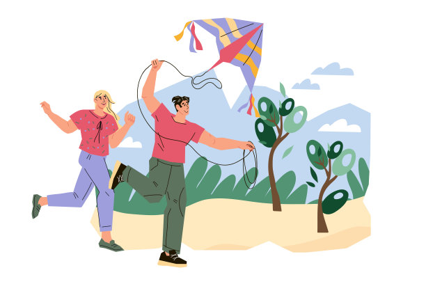 年轻人玩风筝玩得很开心。夏季活动和积极的体育游戏。图片下载