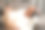 一个中年男人躺在沙发上，戴着耳机听音乐，看手机图片下载