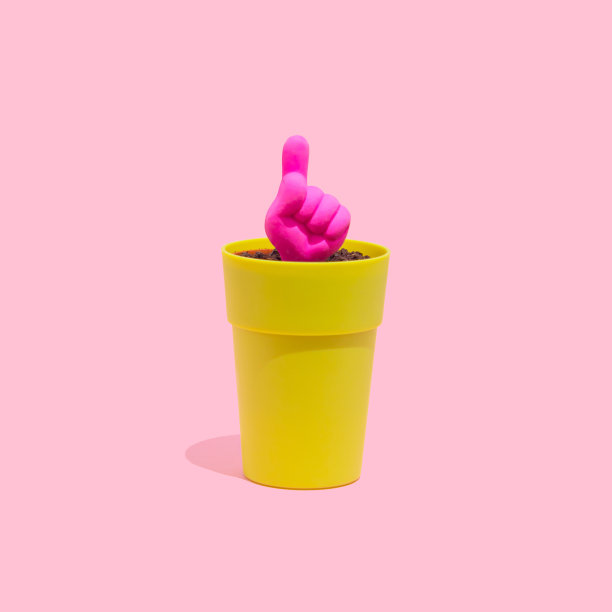 一根手指向上的图标从一个小锅在粉彩粉红色的背景。手势概念。图片下载