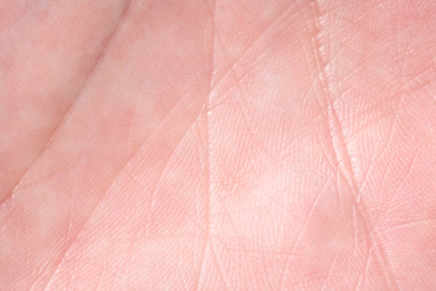 背景是粉红色的皮肤纹理。健康的皮肤。皮肤细胞微距照片。图片下载