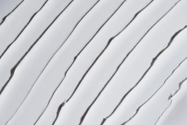 白色保湿质地。近距离刷面霜。身体乳，面膜或防晒霜。护肤美容产品。护手霜背景。护肤样品。化妆品涂抹背景。俯视图图片下载