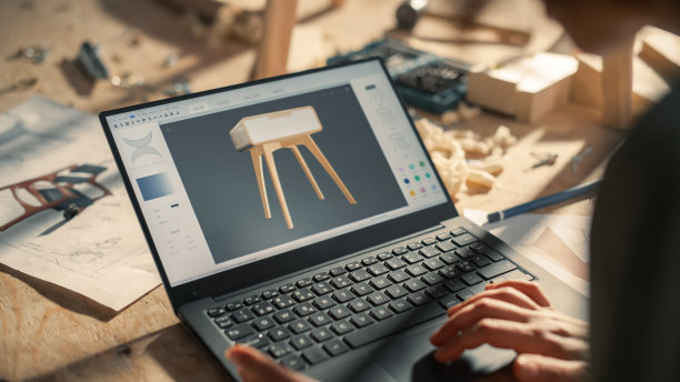 特写镜头的笔记本电脑屏幕与3D图形编辑器与时尚的木制床头柜设计。为木工项目准备家具项目的创意人员。图片下载