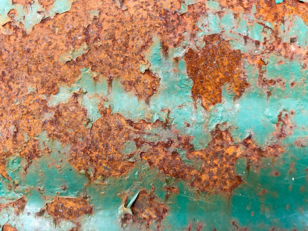 有着美丽图案的根深蒂固的铁锈渍。图片下载