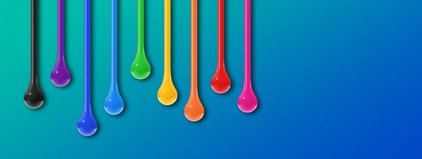 蓝色背景上的彩色墨水滴。水平的旗帜图片下载