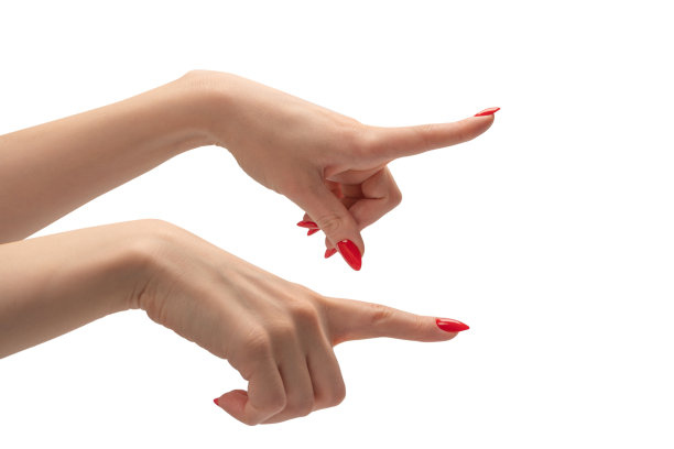 女性手的特写，皮肤苍白，红色指甲指向或触摸。图片下载