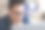 年轻英俊的男子在眼镜看着电脑屏幕的肖像图片下载