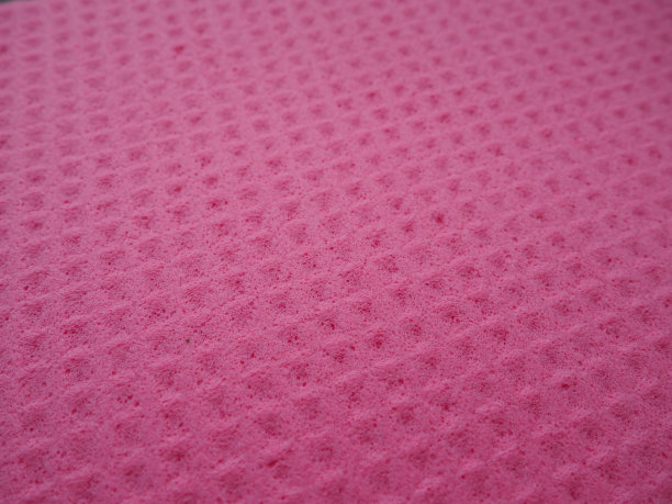 海绵纤维海绵纹理图案表面特写粉红色背景图片下载