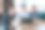 三个年轻人在办公室里，一边看着笔记本电脑屏幕，一边讨论工作上的事情图片下载