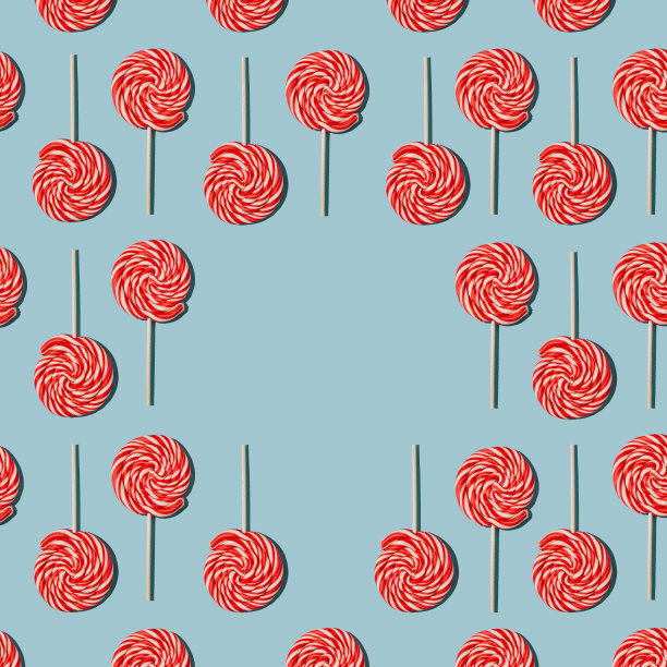 蓝色背景上的棒棒糖图案。CopySpace，锐光图片下载