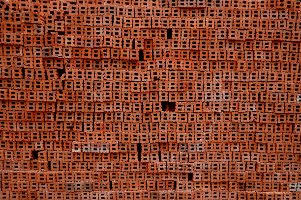 一堆建筑材料一堆新红砖作为建筑背景图片下载