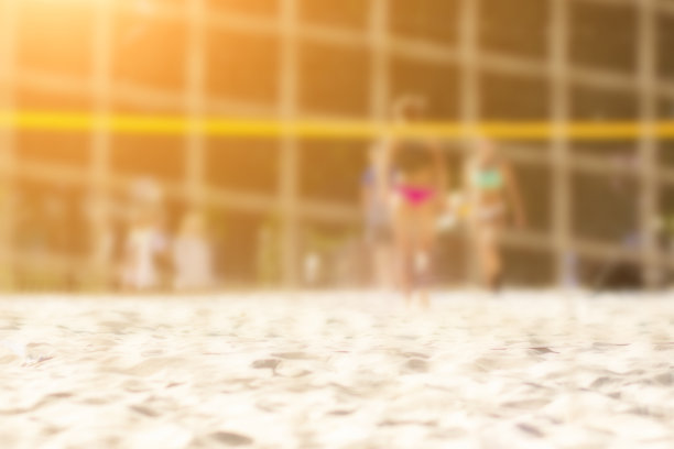 沙滩排球模糊背景，夏日运动图片下载