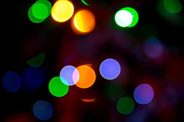 背景模糊抽象的彩灯和装饰。街道彩灯的散景纹理图片下载