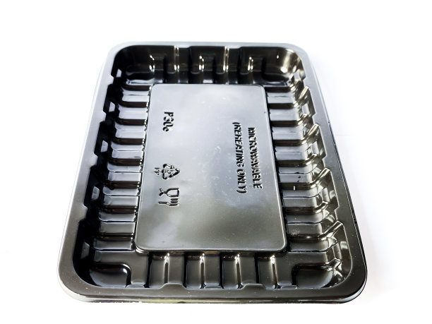 白色背景的黑色塑料食品容器图片下载