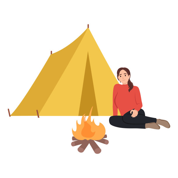 年轻的白人妇女坐在营地的营火旁。旅行的女人坐在篝火旁的圆木上。在营火旁休息的妇女图片下载