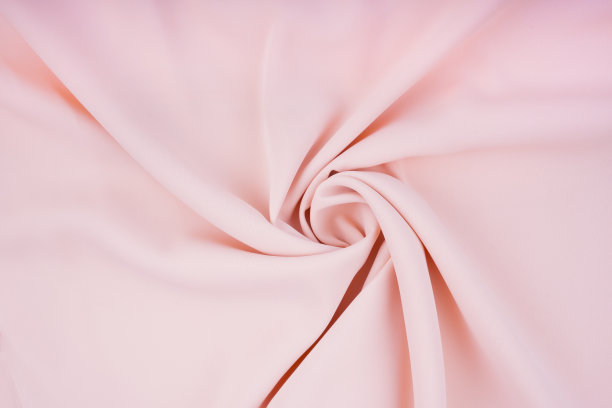 真丝织物在柔和的颜色背景纹理。图片下载