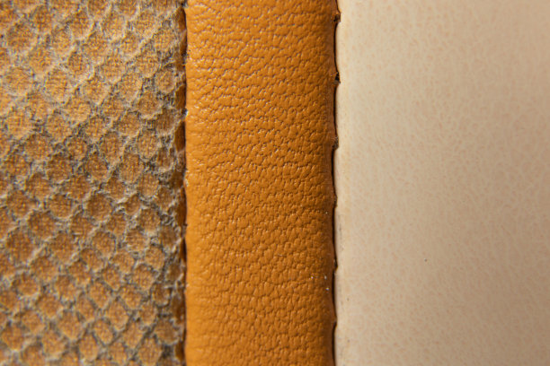 三缝线条米色织物作为不同色调的背景特写图片下载