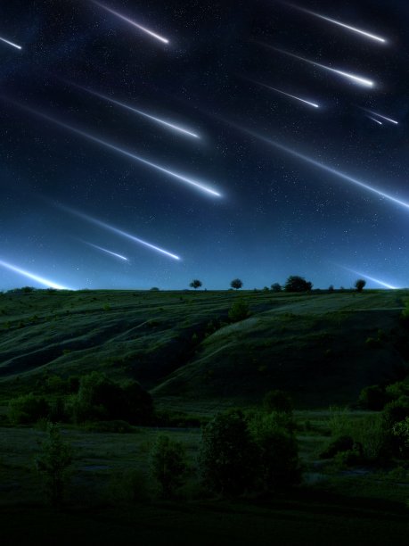 流星雨在山上的天空。美丽的陨石流。图片下载