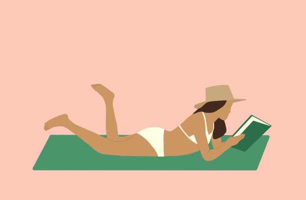 一个度假时躺着看书的年轻女子图片下载
