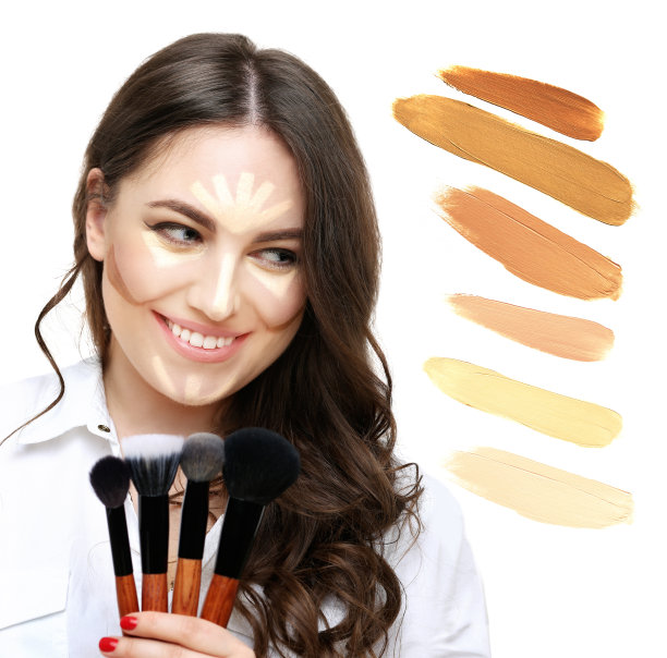 化妆。轮廓和突出化妆。用化妆刷化妆的女人。化妆粉和粉底的阴影在白色的背景图片下载