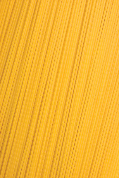 传统意大利面生干生面食微距特写背景，大而细的垂直纹理图案图片下载