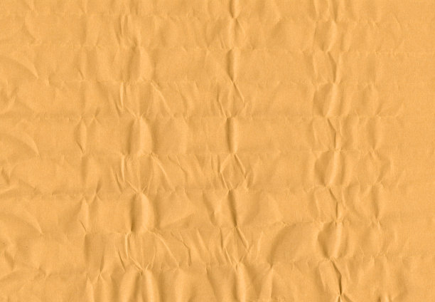 黄色包装纸有凹痕和混乱的褶皱纹理图片下载