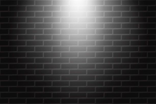 黑色砖墙纹理背景与聚光灯的光图片下载