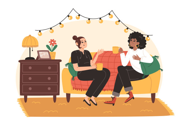 年轻的妇女们正坐在客厅舒适的沙发上愉快地交谈图片下载