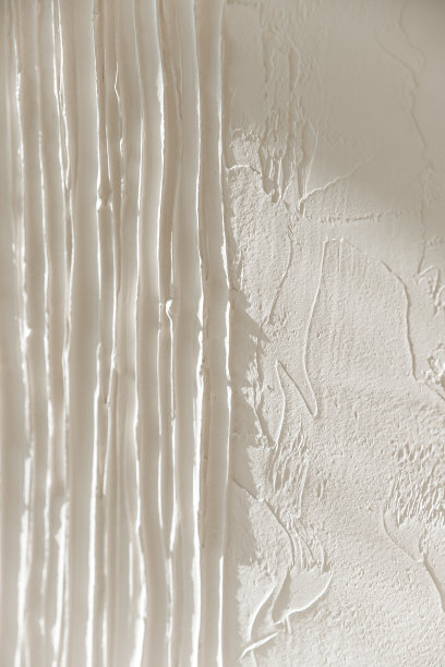 白色体积纹理的石膏为背景。墙上有纹理的灰泥。现代3d艺术。本空间图片下载