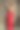 身穿优雅的东方红色连衣裙的年轻黑发女子站在有质感的中世纪墙壁前图片下载