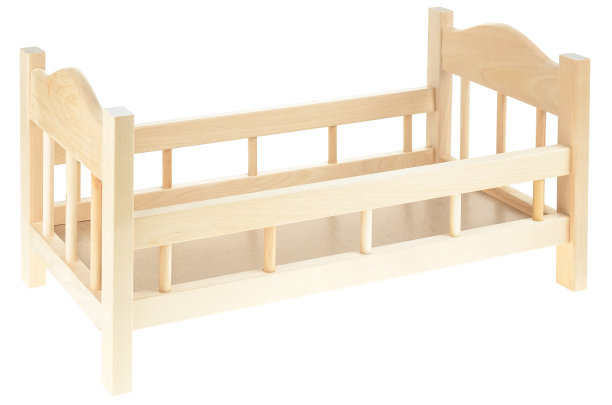 白色背景上的木制婴儿床。给娃娃的玩具婴儿床。摇篮曲的框架，儿童房间的家具图片下载