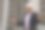 一个快乐的印度建筑工人戴着建筑工人的头盔站在一个建筑商的财产前。图片下载