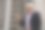 一个快乐的印度建筑工人戴着建筑工人的头盔站在一个建筑商的财产前。图片下载
