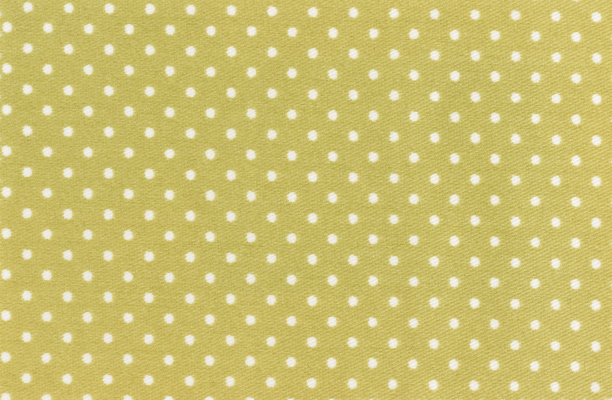 黄绿色和白色圆点婴儿纺织品背景图片下载
