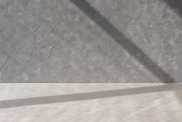 斯堪的纳维亚风格的空房间，几何阳光光影，灰色混凝土墙面纹理和米色地板，空白的家居室内背景图片下载