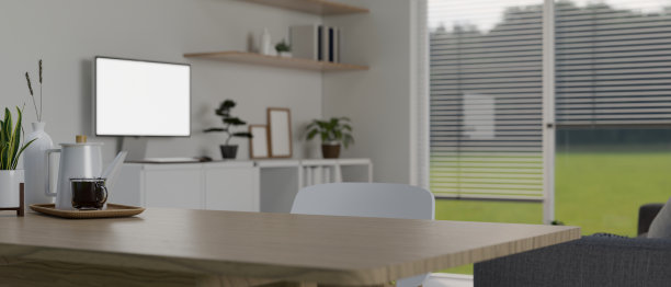 在最小的白色客厅里，在木桌上复制空间，咖啡壶和咖啡杯。图片下载