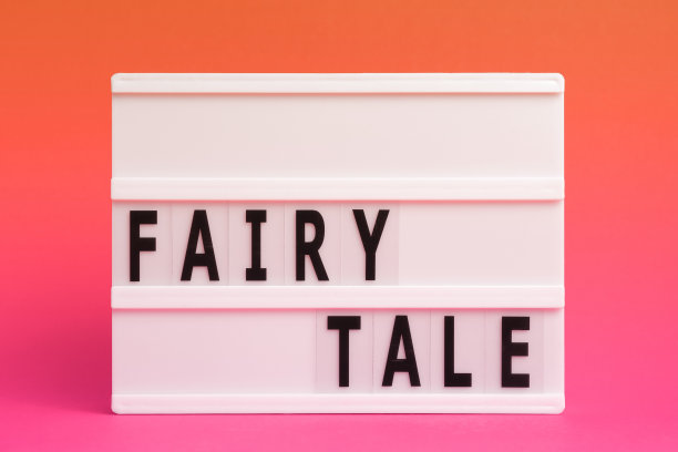 灯箱上的童话字孤立的粉红色背景。文学流派图片下载