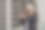 一个快乐的印度建筑工人戴着建筑工人的头盔站在一个建筑商的财产前。工程师安全帽。图片下载