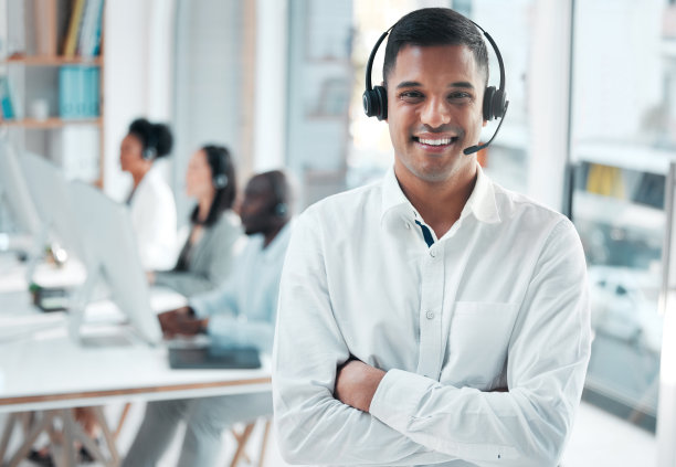 Crm, manager or portrait of man in call center smiles with pride, helping advice or networking online. Face, smile or happy Indian insurance agent in communication at customer services or sales job图片下载