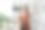 年轻迷人的亚洲女性白领，正西装革履，在现代办公室对着镜头微笑图片下载